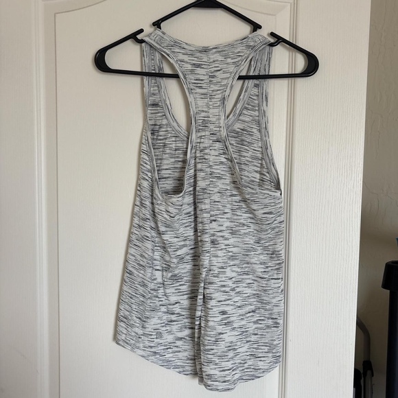 Lululemon black and white racer back tank. Can tie in the the back. - Picture 2 of 2